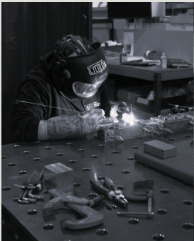 CMD engineer welding marine components in the workshop